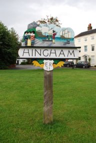 An image of Hingham Village sign, which depicts parishoners about to set sail for the New World